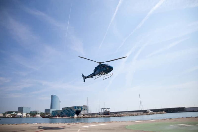 Barcelona: Helicopter Flight over Barcelona's Coastline - Agbar Tower and the big modern landmarks on the waterfront
