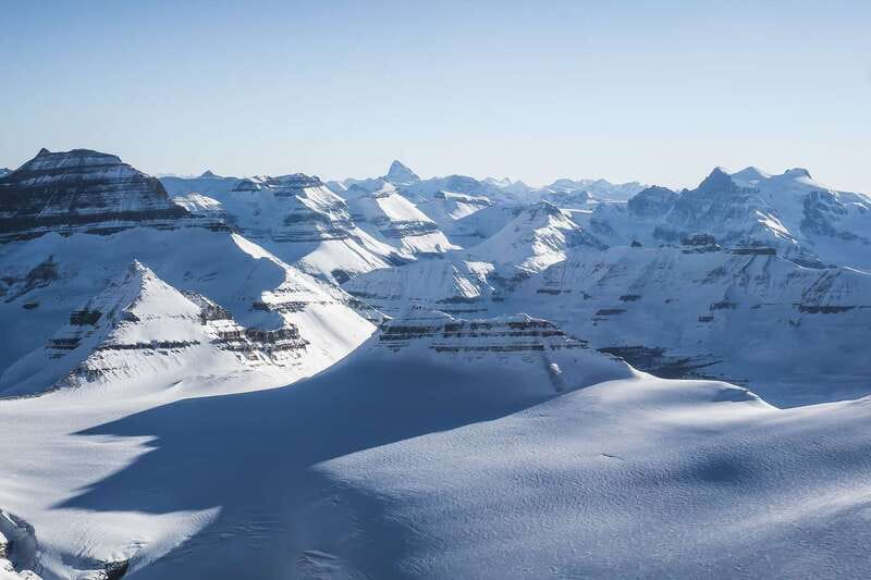 Canadian Rockies: Abraham Lake Ice Bubbles Helicopter Tour - Helicopter Flight: Reading Glaciers and Frozen Water Below