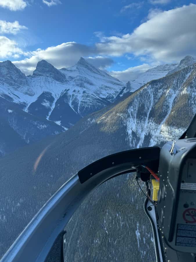 Canmore: 25-Minute Three Sisters Helicopter Tour - Entering Spray Valley: reservoir on the left, pond on the right