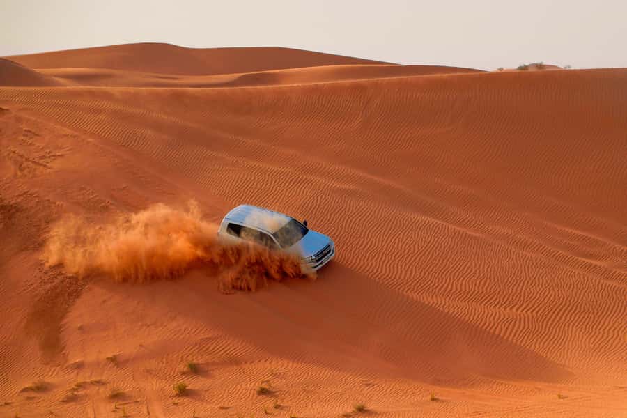 Dubai: Helicopter Ride, Desert Safari, Camels & Refreshments - Quad Biking Over Red Dunes: Fun, Fast, and Definitely Not Risk-Free