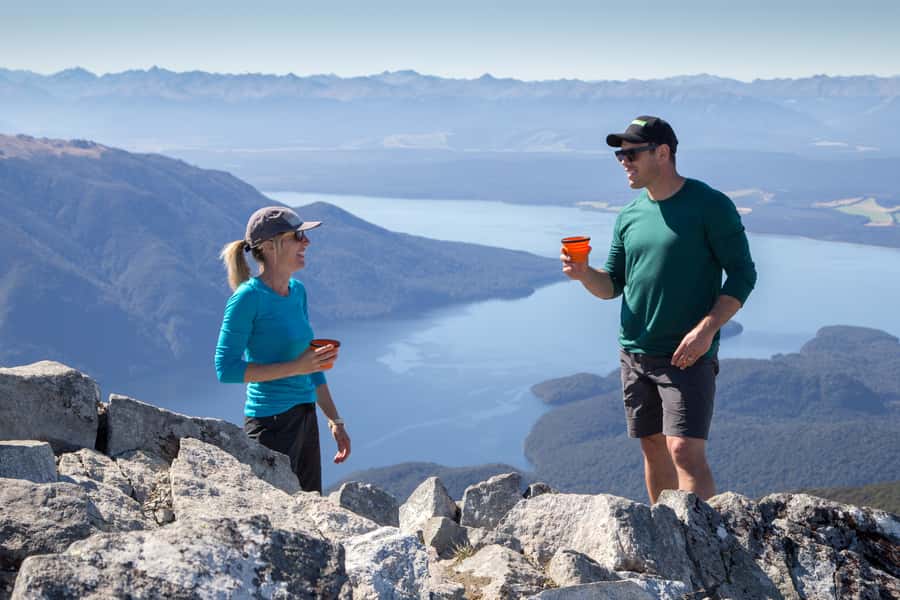 From Te Anau: Full Day Kepler Track Guided Heli-Hike - Brod Bay, the pickup point, and the walk-to-boat moment