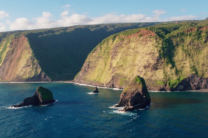 Kohala Waterfalls with Exclusive Landing Helicopter Tour - Valley of the Kings: cliffs, scale, and Kamehameha I’s boyhood home