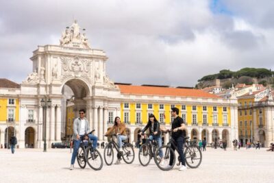 Lisbon: Guided Bike Tour, Helicopter Flight, and Boat Trip - The guided walking stretch: St. Roque, Carmo ruins, Alfama Cathedral, Praça do Comércio