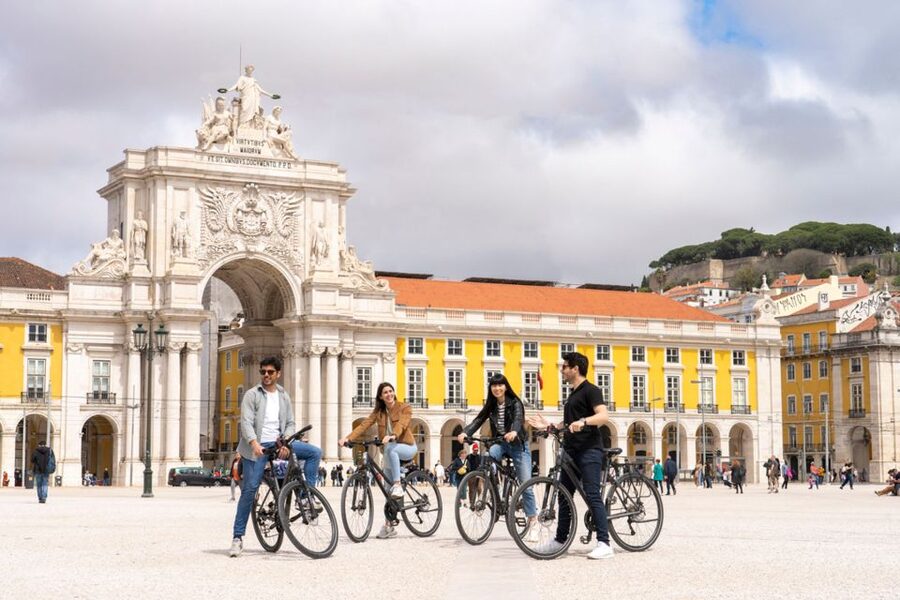 Lisbon: Guided Bike Tour, Helicopter Flight, and Boat Trip - The guided walking stretch: St. Roque, Carmo ruins, Alfama Cathedral, Praça do Comércio