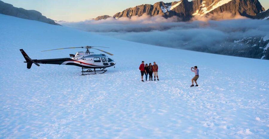 Milford Sound: Helicopter Flight with Glacier Landing - Flying Toward Tutoko Glacier: Forests, Lakes, and the Tasman Sea