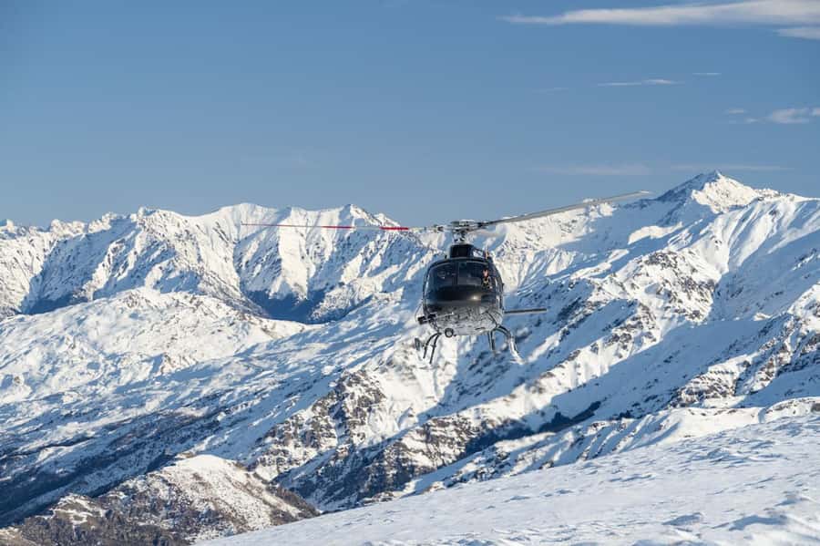 Queenstown Helicopter Flight with Snow Landing | 30 mins - Soaring over Queenstown, then stepping onto snow