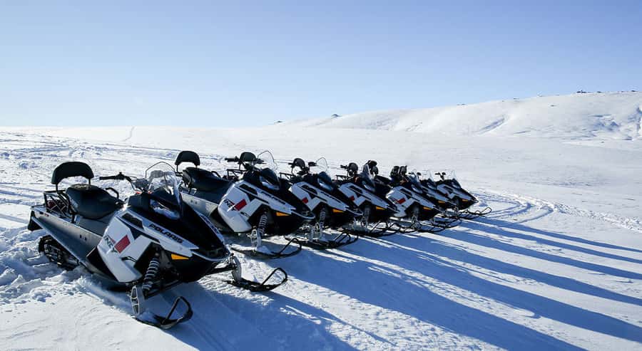 Queenstown: Snowmobiling Experience with Helicopter Flight - Snowmobiling the Garvie Mountain Range: guided, fast, and photo-friendly