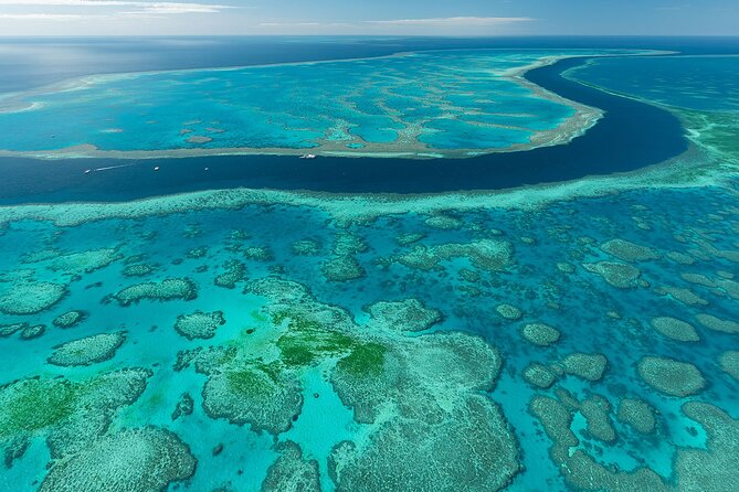 Reef & Whitehaven Spectacular - 60 Minute Helicopter Tour - First flight views: Mount Rooper, Shute Harbour, and the island lineup